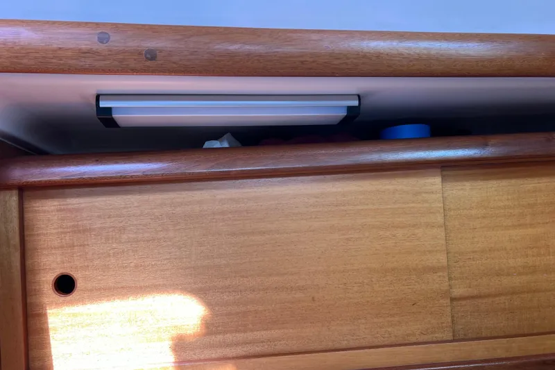 Slide: The Image of Wooden interior detail of a 2007 Delphia 33 Sloop sailboat. - 93