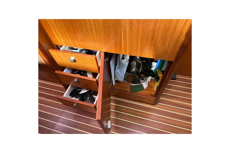 Slide: The Image of Interior storage of 2007 Delphia 33 Sloop with open drawers and cabinets. - 95