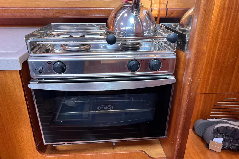 Slide: The Image of Stainless steel stove and oven in 2007 Delphia 33 Sloop yacht kitchen. - 97