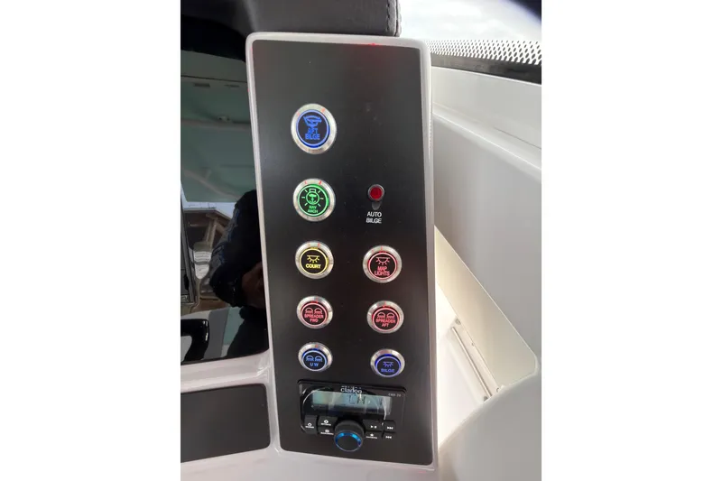 Slide: The Image of 2025 Robalo R250 Center Console boat interior with seating and console view. - 16