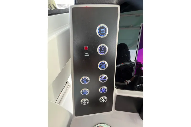 Slide: The Image of 2025 Robalo R250 Center Console boat docked, showcasing spacious deck and sleek design. - 20