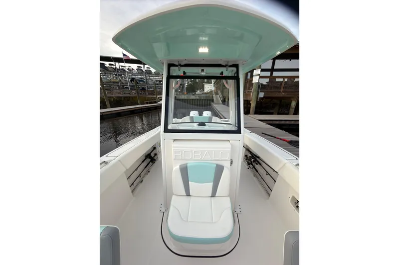 Slide: The Image of 2025 Robalo R250 Center Console interior with speakers and storage compartment. - 27