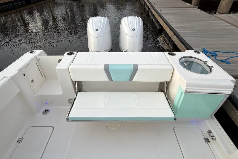 Slide: The Image of 2025 Robalo R250 Center Console boat interior with advanced navigation system and steering wheel. - 28
