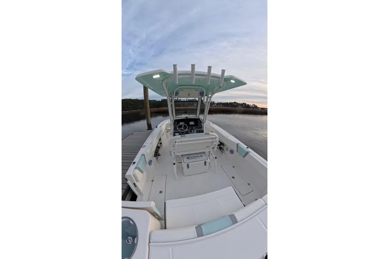 Slide: The Image of 2025 Robalo R250 Center Console boat on calm water, featuring Yamaha outboard engine. - 3