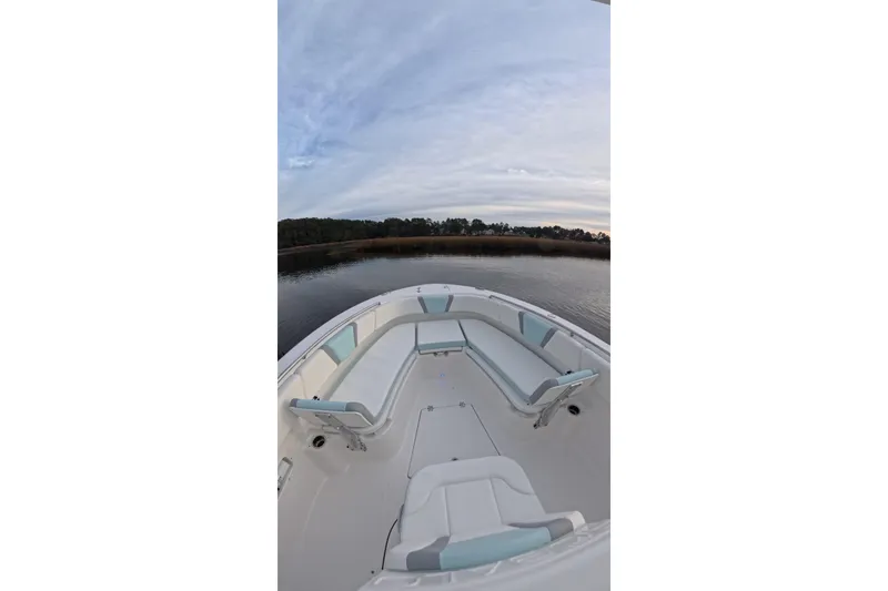 Slide: The Image of 2025 Robalo R250 Center Console boat cruising on open water. - 5