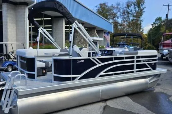 The Image of 2026 Bennington 20 SL pontoon boat with sleek design, docked outdoors. - 0