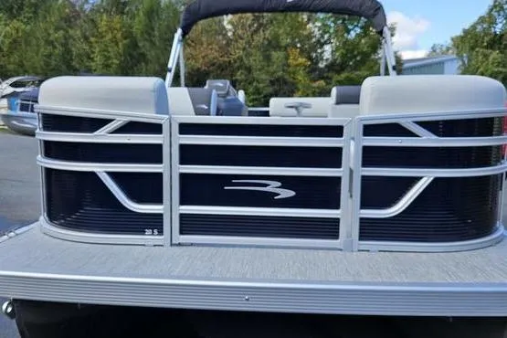 Slide: The Image of 2026 Bennington 20 SL pontoon boat front view with sleek design and modern features. - 1