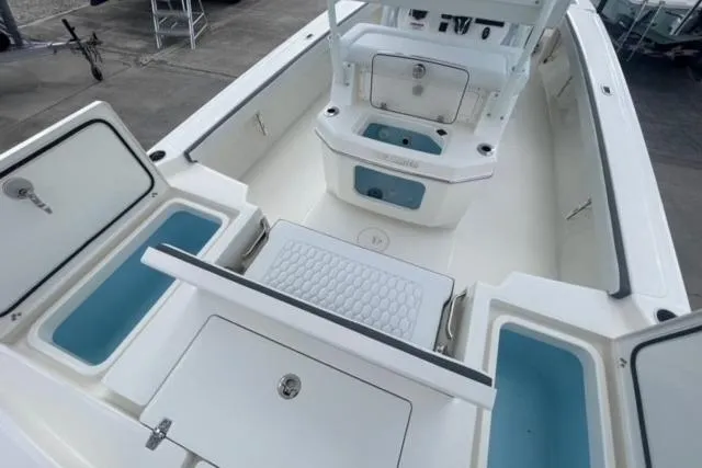 Slide: The Image of 2026 Pathfinder 2600 TRS boat interior with storage compartments and seating. - 15