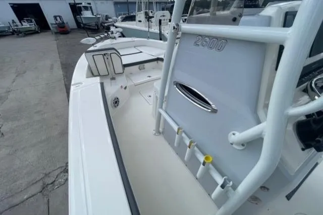 Slide: The Image of 2026 Pathfinder 2600 TRS boat, white deck, docked in a marina, side view. - 17