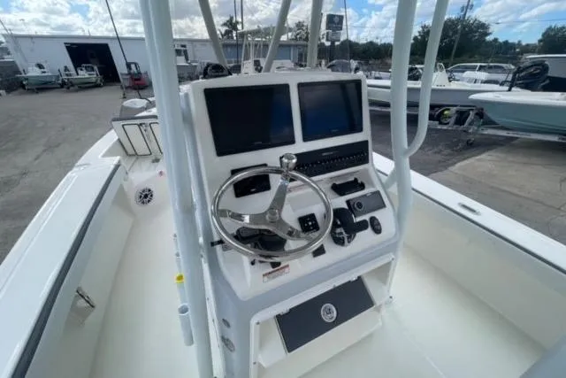 Slide: The Image of 2026 Pathfinder 2600 TRS boat console with dual screens and steering wheel. - 23