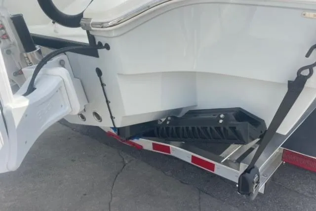 Slide: The Image of 2026 Pathfinder 2600 TRS boat on trailer, rear view showing hull and support structure. - 3