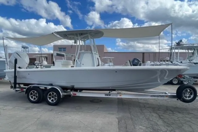 Slide: The Image of 2026 Pathfinder 2600 TRS boat on trailer under cloudy sky. - 5