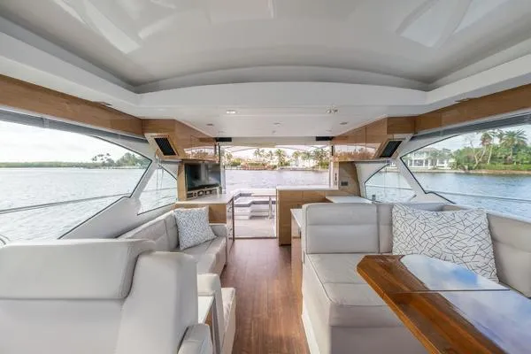 Slide: The Image of Interior of 2018 Cruisers Yachts 50 Cantius with modern amenities and waterfront view. - 12