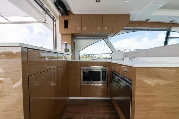 Slide: The Image of Luxurious interior of 2018 Cruisers Yachts 50 Cantius with modern furnishings and panoramic windows. - 15