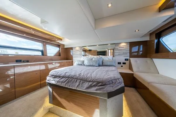 Slide: The Image of Luxurious bedroom interior of 2018 Cruisers Yachts 50 Cantius with modern design and large windows. - 18