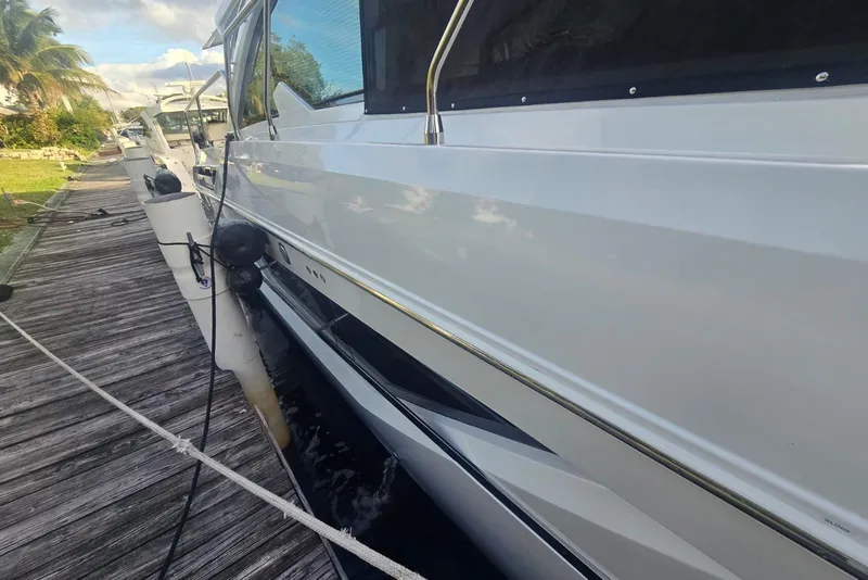 Slide: The Image of Engine room of 2018 Cruisers Yachts 50 Cantius, featuring mechanical components and piping. - 38