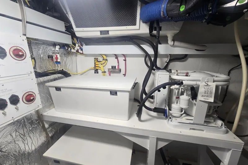 Slide: The Image of Engine room of 2018 Cruisers Yachts 50 Cantius, showcasing electrical and mechanical systems. - 62