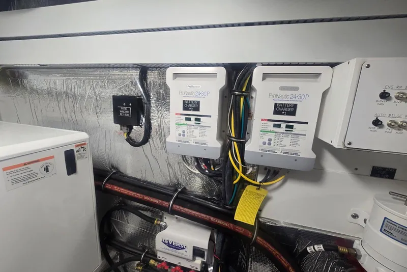 Slide: The Image of Engine room of 2018 Cruisers Yachts 50 Cantius with fuel filters and control panel. - 65