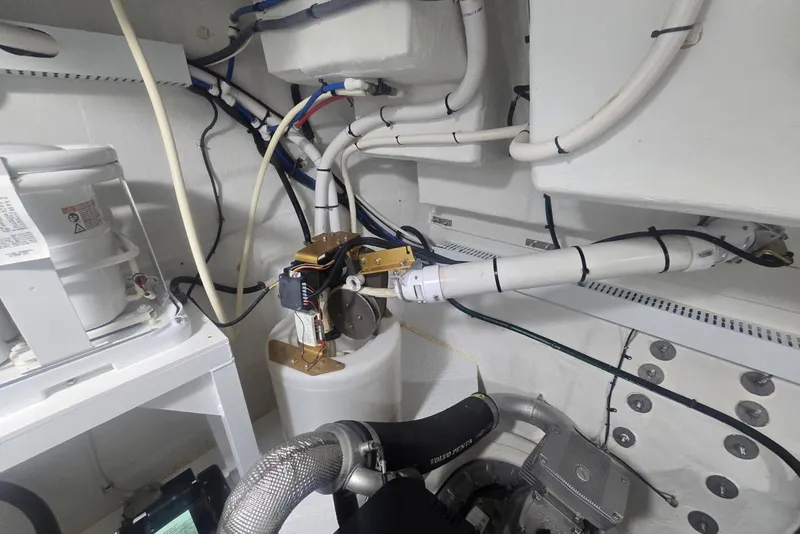 Slide: The Image of Engine compartment of 2018 Cruisers Yachts 50 Cantius, showcasing mechanical components. - 67