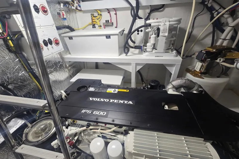 Slide: The Image of Engine room of 2018 Cruisers Yachts 50 Cantius, showcasing mechanical components and wiring. - 68