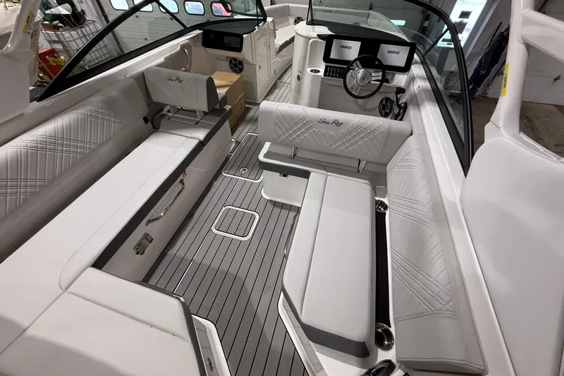 Slide: The Image of 2026 Sea Ray SDX 270 boat interior with luxurious seating and modern dashboard. - 10