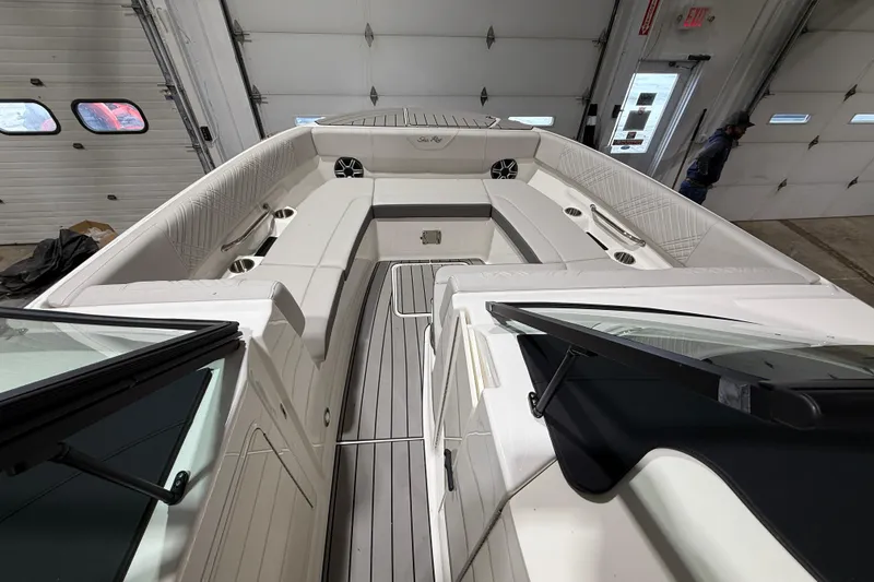 Slide: The Image of 2026 Sea Ray SDX 270 boat interior with spacious seating and modern design. - 16