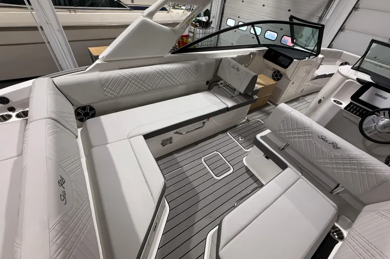 Slide: The Image of Luxurious interior of 2026 Sea Ray SDX 270 boat with elegant seating and modern dashboard. - 9