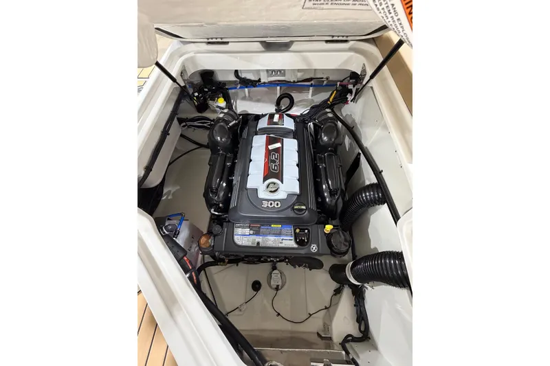 Slide: The Image of Engine compartment of 2026 Sea Ray SDX 250 boat, showcasing powerful 300 horsepower engine. - 15