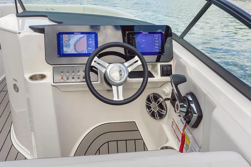 Slide: The Image of Manufacturer Provided Image: 2025 Sea Ray SDX 250 helm with dual navigation screens and modern controls. - 6