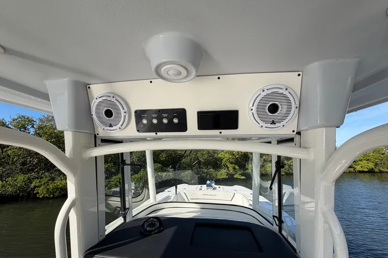 Slide: The Image of 2025 World Cat 295 CC boat interior with speakers and control panel. - 15