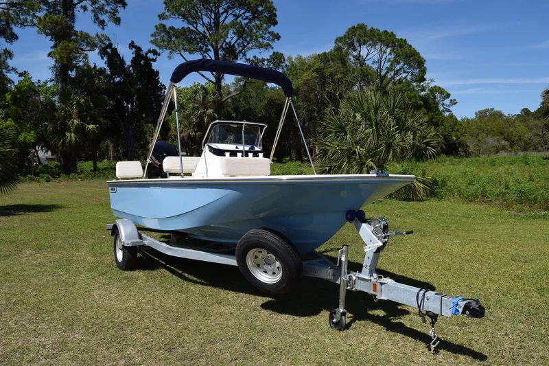 Slide: The Image of 2026 Boston Whaler 170 Montauk boat on trailer outdoors. - 1