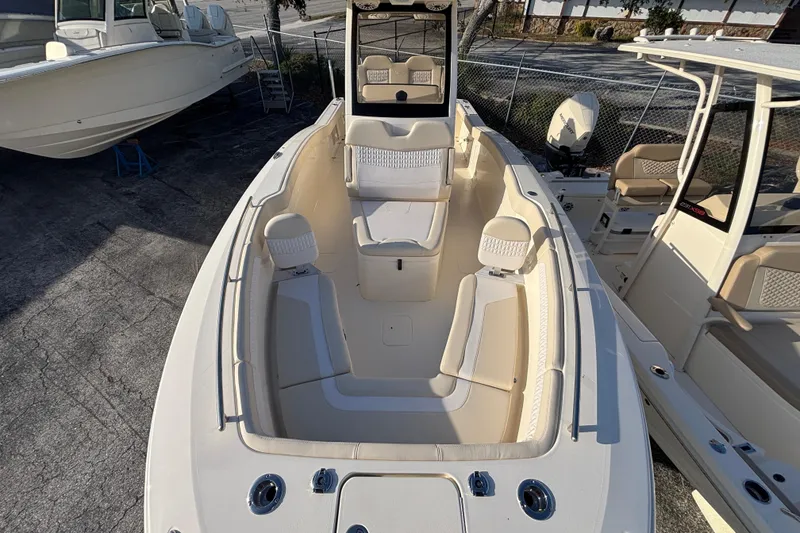 Slide: The Image of 2026 Scout 260 LXF boat with spacious seating and modern design. - 12