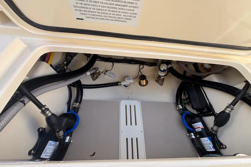 Slide: The Image of 2026 Scout 260 LXF boat interior showing engine compartment and wiring. - 19