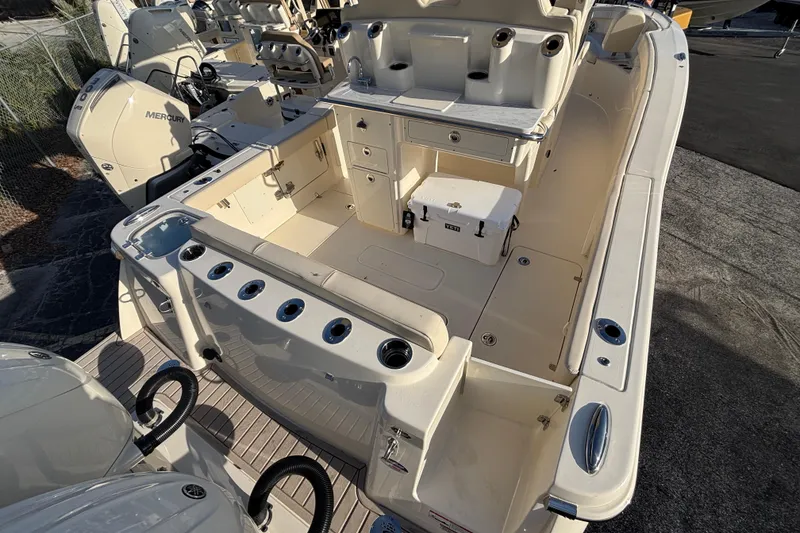 Slide: The Image of 2026 Scout 260 LXF boat interior with storage and seating, featuring Mercury engines. - 4