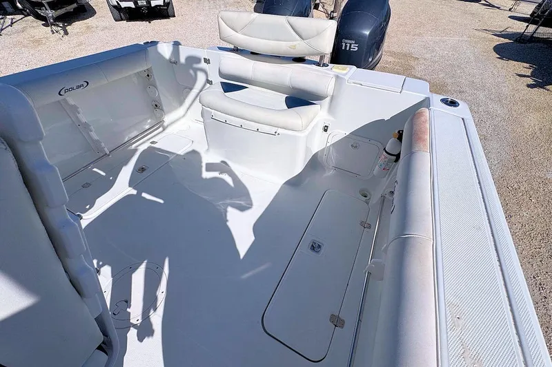 Slide: The Image of 2006 Polar 2300 CC boat interior with seating and storage compartments. - 4