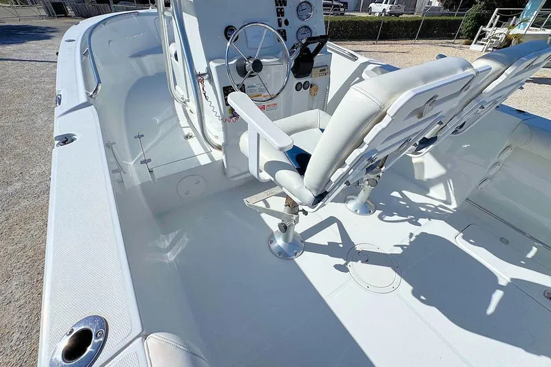 Slide: The Image of 2006 Polar 2300 CC boat interior with steering wheel and seating. - 5