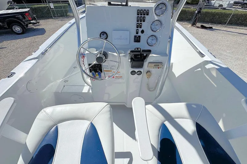 Slide: The Image of 2006 Polar 2300 CC boat cockpit with steering wheel and control panel. - 6