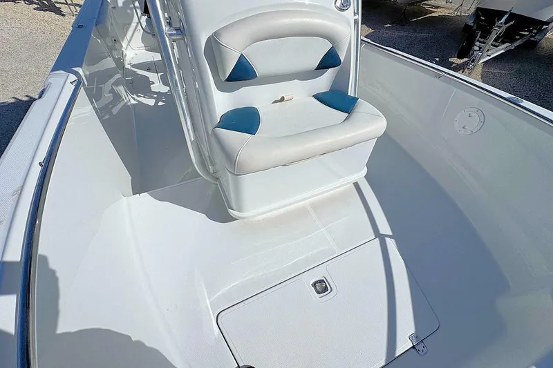 Slide: The Image of 2006 Polar 2300 CC boat interior with cushioned seating and storage compartment. - 9