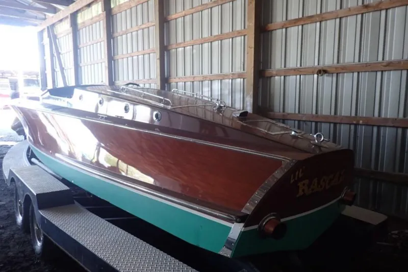 Slide: The Image of 2004 Mays Craft 25 Gentlemans Racer in storage, showcasing classic wooden design. - 2