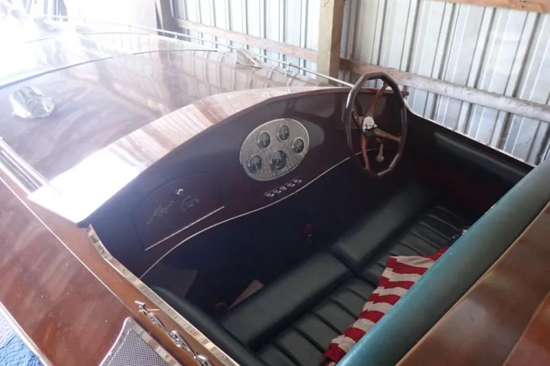 Slide: The Image of 2004 Mays Craft 25 Gentleman's Racer interior with wooden dashboard and leather seating. - 4