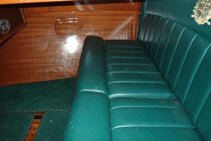 Slide: The Image of Luxurious interior of 2004 Mays Craft 25 Gentlemans Racer with green leather seating. - 8