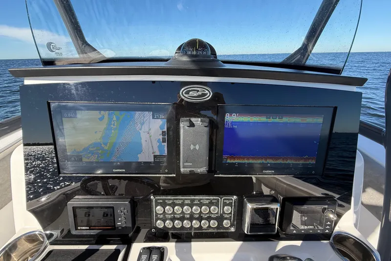 Slide: The Image of Dashboard of 2021 Sea Fox 288 Commander with Garmin navigation displays. - 19