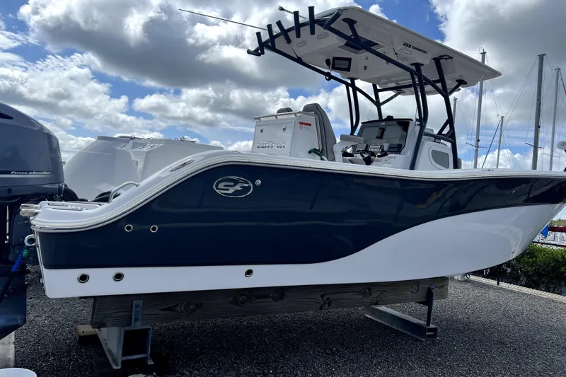 Slide: The Image of 2021 Sea Fox 288 Commander boat on sparkling blue water. - 2