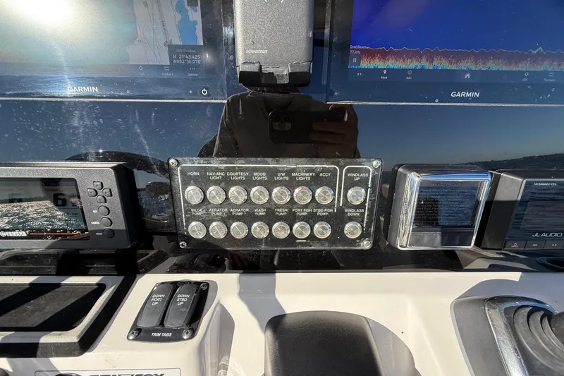 Slide: The Image of Control panel of a 2021 Sea Fox 288 Commander boat with Garmin displays. - 22