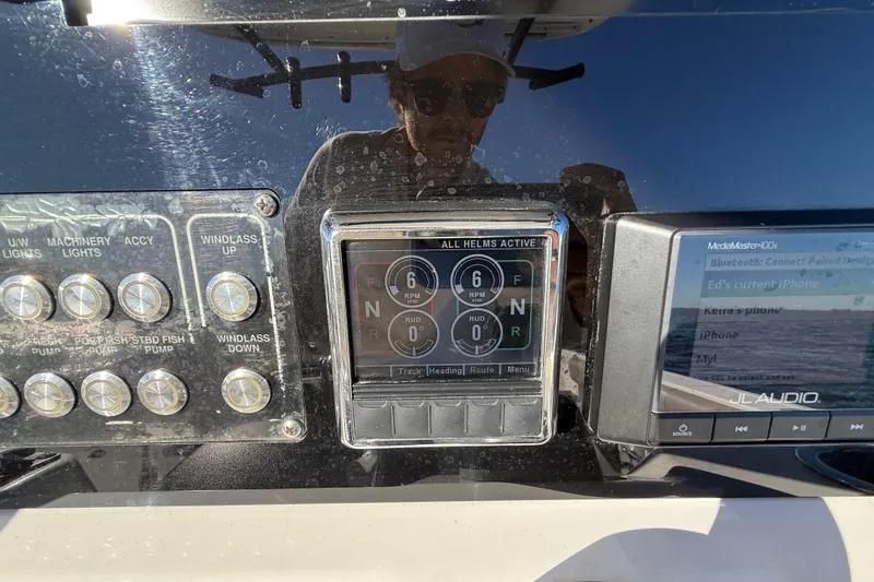 Slide: The Image of Control panel of a 2021 Sea Fox 288 Commander boat with various switches and displays. - 24