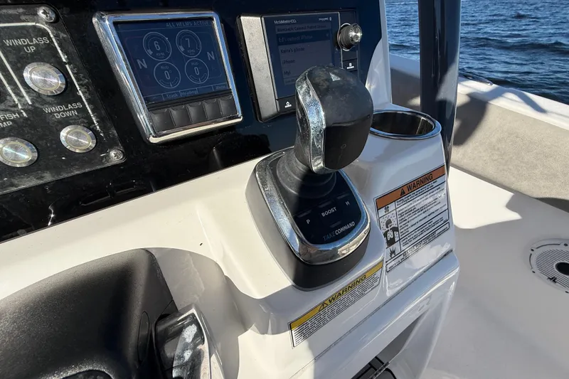 Slide: The Image of Control panel of 2021 Sea Fox 288 Commander boat with throttle and display screens. - 27