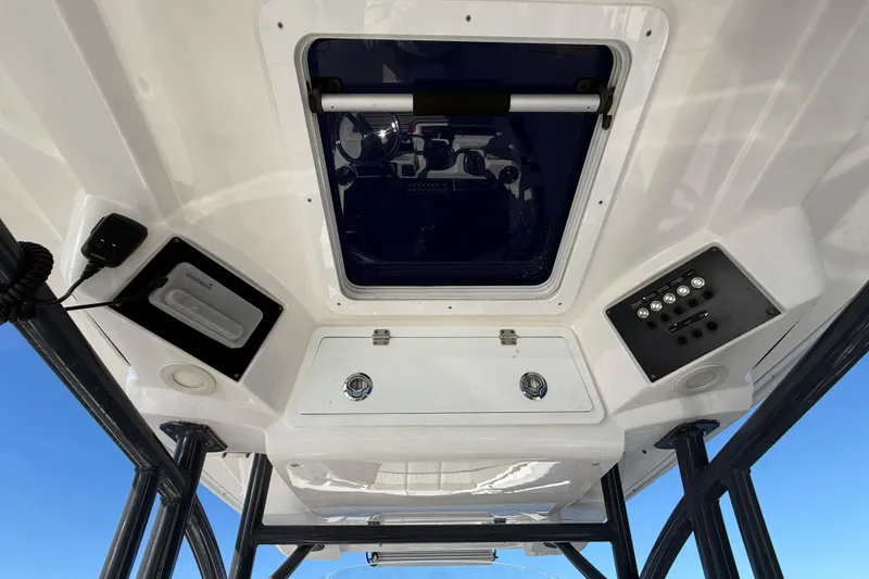 Slide: The Image of 2021 Sea Fox 288 Commander boat console with controls and storage compartments. - 29