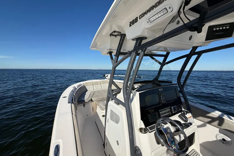 Slide: The Image of 2021 Sea Fox 288 Commander boat on open water, showcasing helm and seating area. - 34