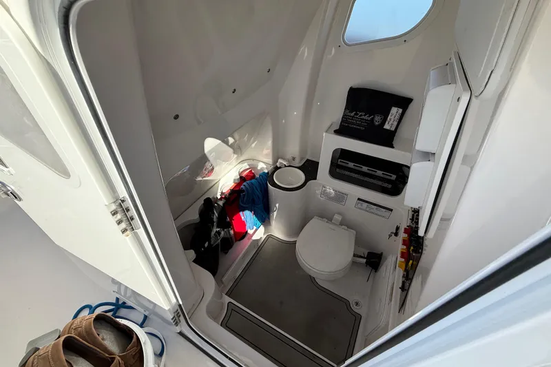 Slide: The Image of Interior of 2021 Sea Fox 288 Commander boat, featuring compact bathroom amenities. - 36