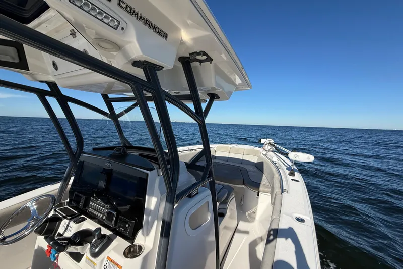 Slide: The Image of 2021 Sea Fox 288 Commander boat on open water, showcasing helm and seating area. - 42